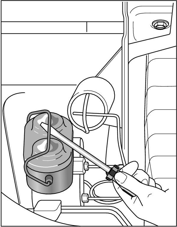 Figure 2-13:  Releasing the lid of a metal master cylinder with a screwdriver.